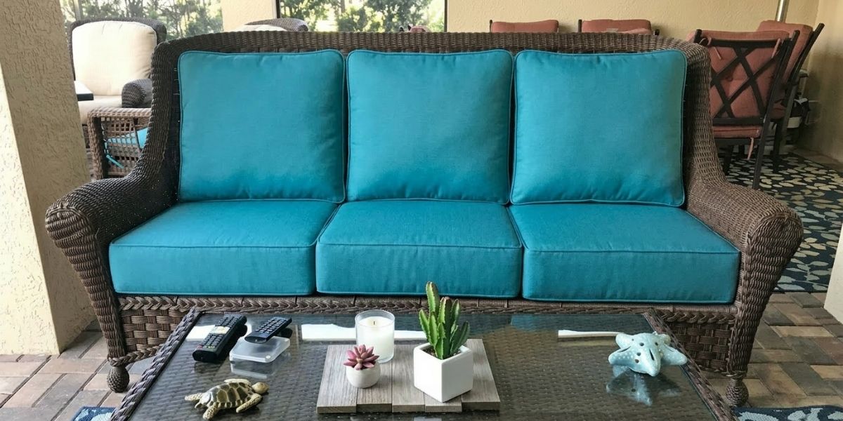 Beautifully Piped, Cozy Cushions Make Wicker Sofa the Best Seat in the House