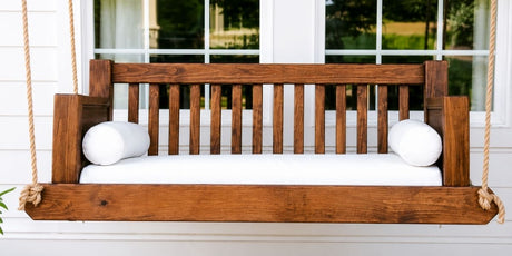 Traditional Porch Swing Stands Out With Classic White Sunbrella Cushions