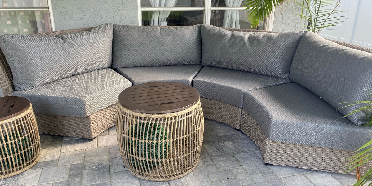 Curved Sofa Gets Trapezoid Seat Cushions in Sunbrella Integrated Steel - Patio Lane