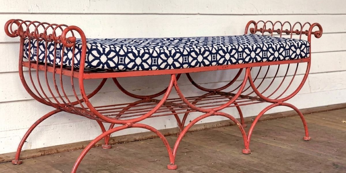 Ornate Cushion in Sunbrella Luxe Indigo Complements Antique Bench