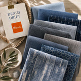 Denim Drift outdoor fabric sample pack featuring chambray, denim, slate and indigo blue fabric swatches