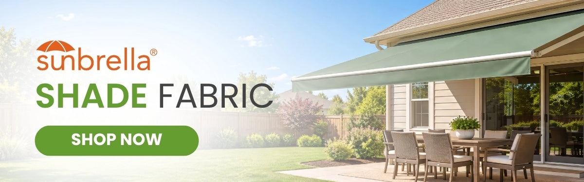 Shop Sunbrella shade fabric for retractable awnings, featuring a sage green awning over a residential backyard dining area
