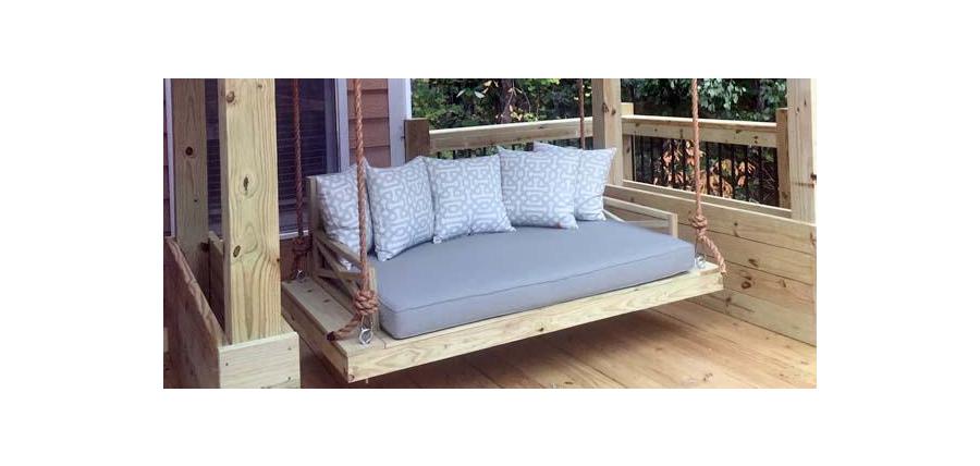 Sunbrella Cast Mist Day Bed Cushion Softens Napping Spot on Rustic Deck