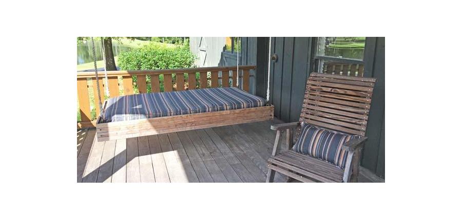 Rustic Porch a Peaceful Spot to Enjoy Sunbrella Swing Bed Cushion and Rocker