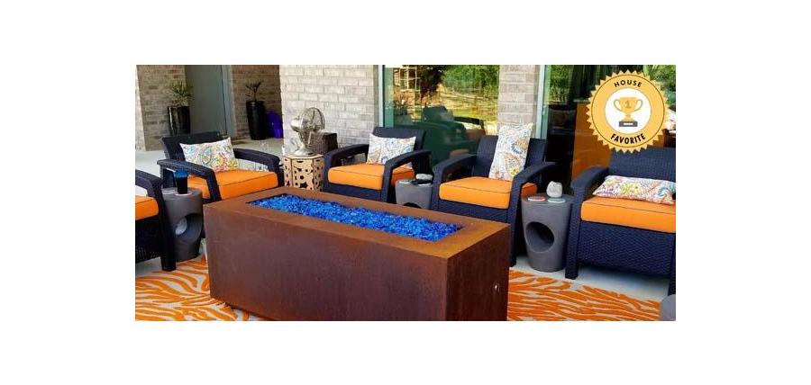 Abundance of Sunbrella Canvas Tangerine Seat Cushions Pop on Luxurious Patio