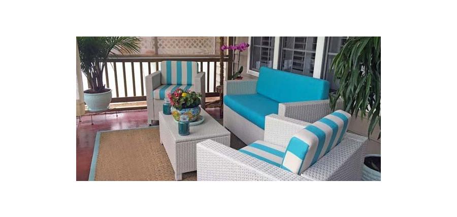 Festive Patio Space Brightened with Sunbrella Turquoise Loveseat and Chair Cushions