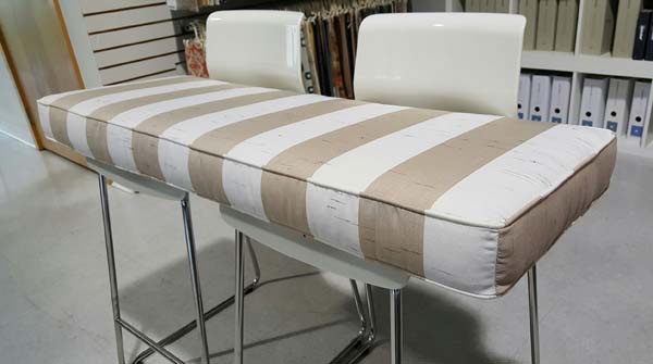 Neutral Sunbrella Striped Seat Cushions Create Comfort in Gathering Areas