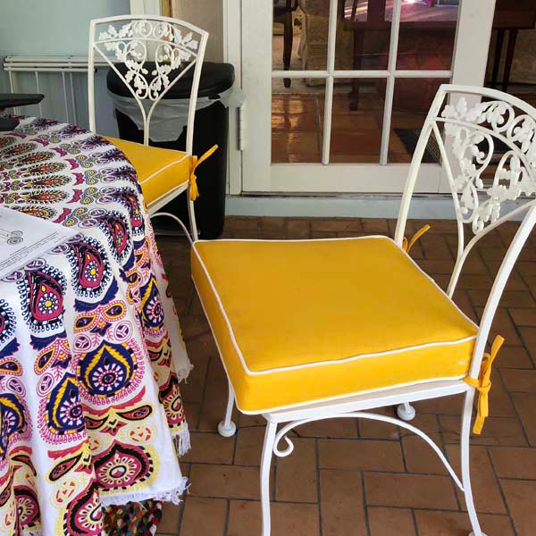 An Array of Bright Sunbrella Cushions Add Splashes of Color to Patio
