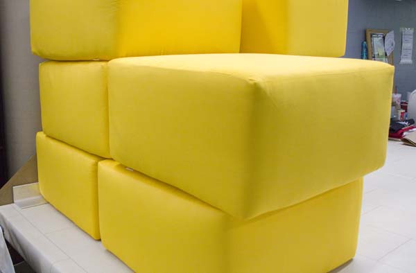 Brightly Colored Sunbrella Ottomans Create Cozy Lounge Space For Middle Schoolers
