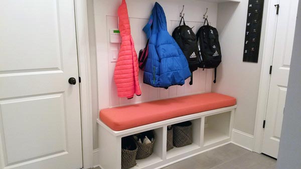 Sunbrella Canvas Melon Bench Cushion Adds Pizzazz to Mudroom Drop Zone