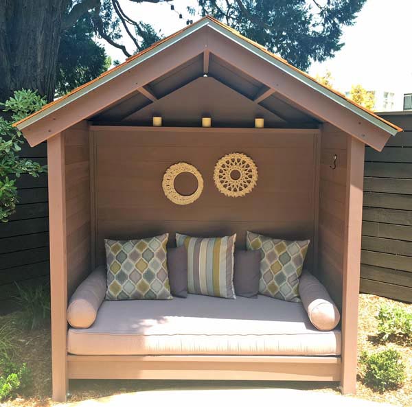 Cozy Daybed Nook with Sunbrella Cushion and Pillows Completes Urban Backyard