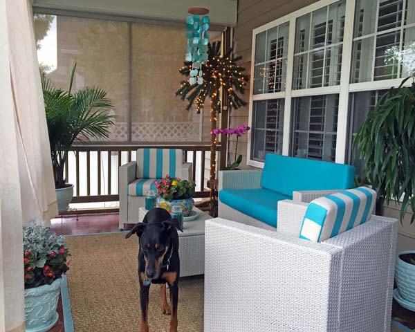 Festive Patio Space Brightened with Sunbrella Turquoise Loveseat and Chair Cushions